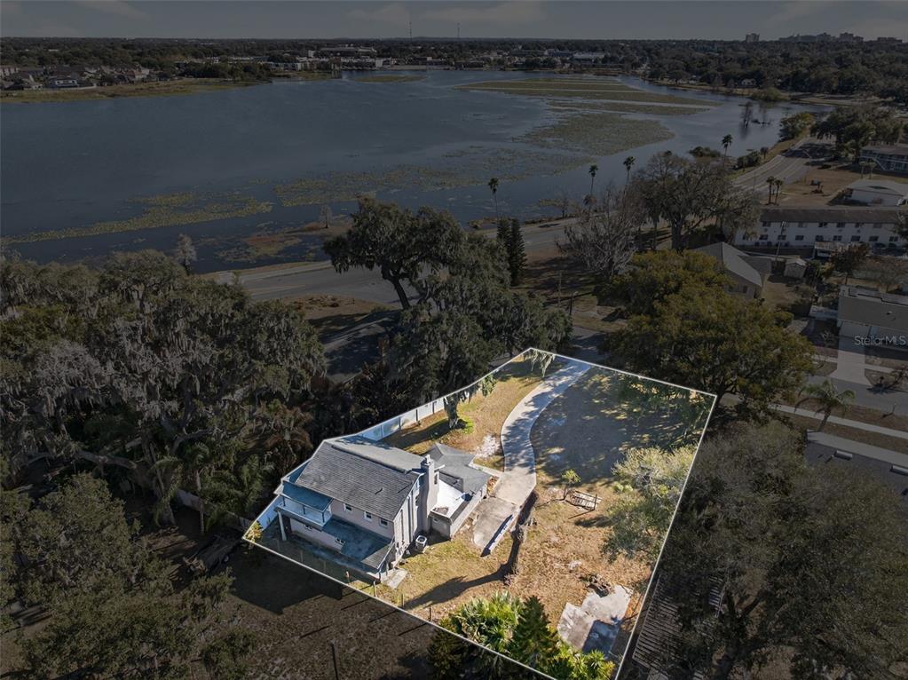 842 Channing Road Lakeland, FL 33805 - Photo 26 of 27 an aerial view of a house with a yard and lake view