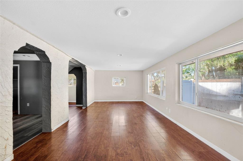 842 Channing Road Lakeland, FL 33805 - Photo 3 of 27 a view of empty room with wooden floor and fan