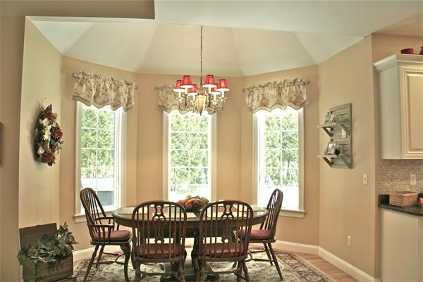 11 Amanda Road Sudbury, MA 01776 - Photo 11 of 30 a view of a dining room with furniture and a chandelier