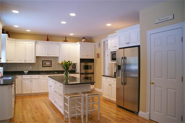 11 Amanda Road Sudbury, MA 01776 - Photo 8 of 30 a kitchen with stainless steel appliances granite countertop a stove refrigerator sink and microwave