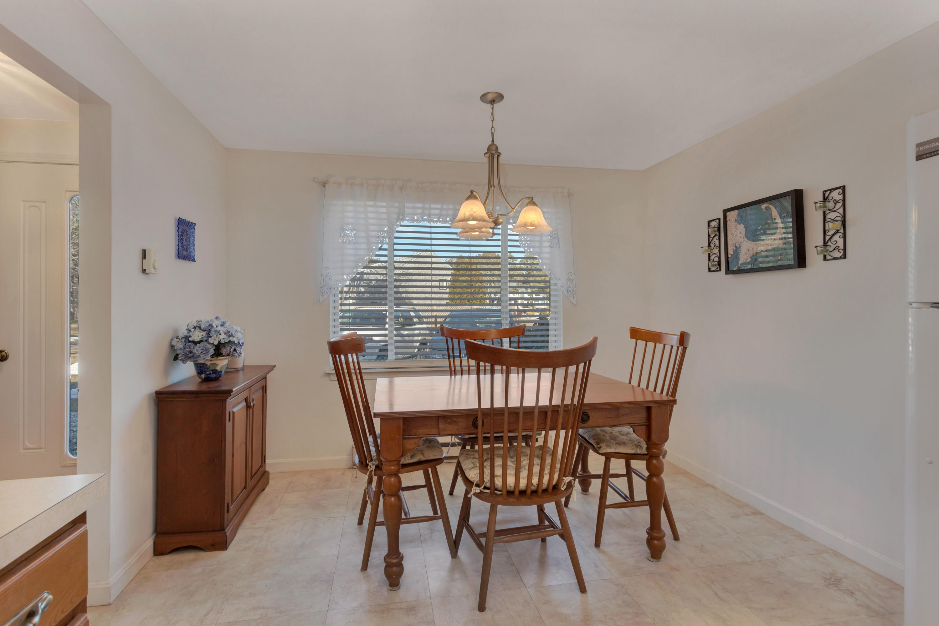 22 Crescent Lane Brewster, MA 02631 - Photo 11 of 43 a view of a dining room with furniture window and outside view
