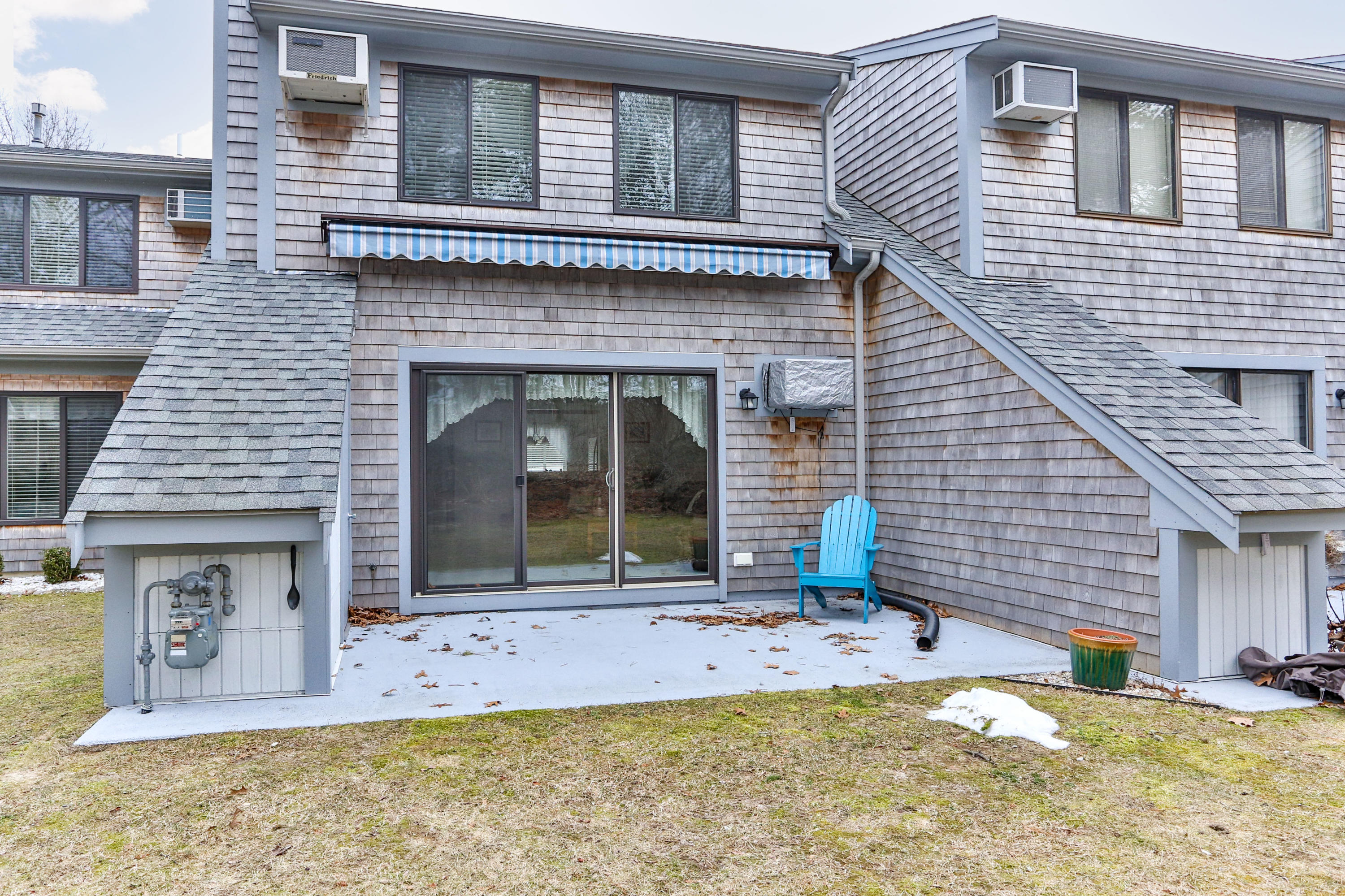 22 Crescent Lane Brewster, MA 02631 - Photo 30 of 43 a front view of a house with a yard