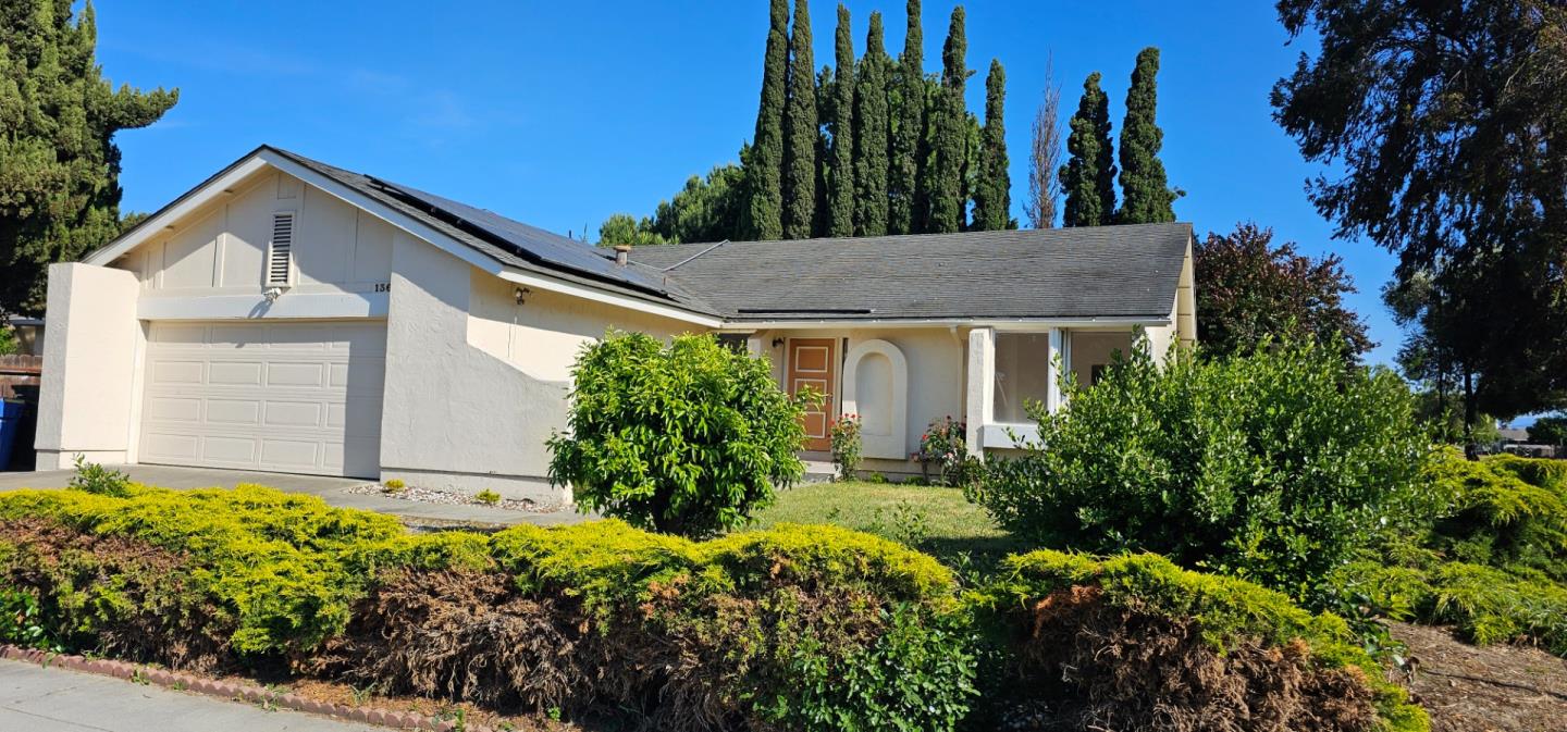 a view of house with small garden