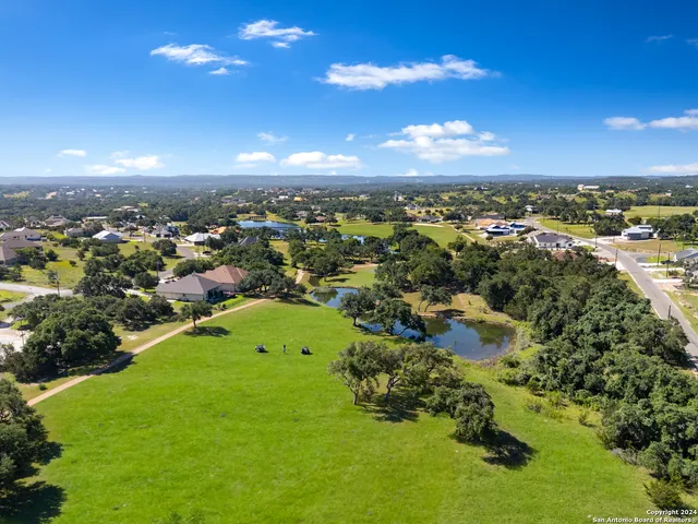 a view of a lake with a yard