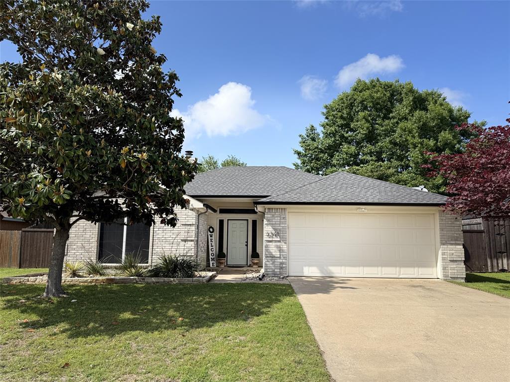 6241 Peach Tree Drive Midlothian, TX 76065 - Photo 1 of 19 Single-story residence featuring light-colored brick exterior, a dark shingle roof, and an attached two-car garage