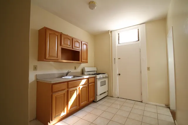 a view of an empty room and a window