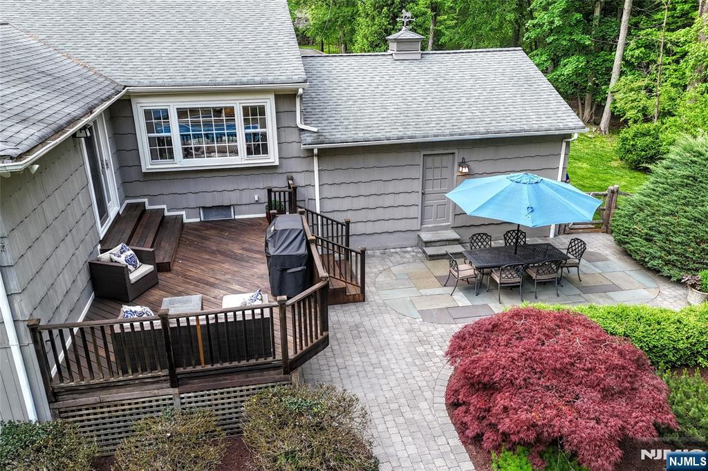 60 Dimmig Road Upper Saddle River, NJ 07458 - Photo 7 of 40 an outdoor space with furniture and umbrella