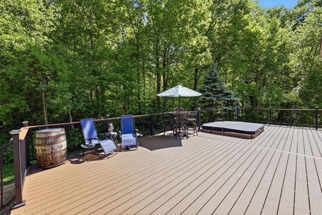345 Bragg Road Warren, MA 01585 - Photo 33 of 41 a view of backyard with seating space and trees