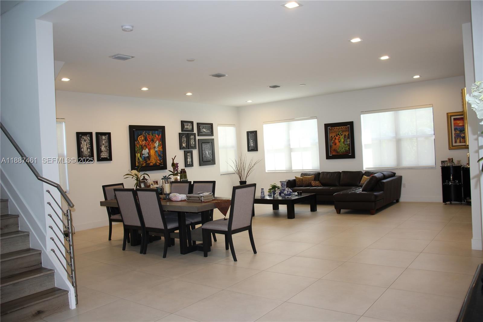 8904 Southwest 69th Trail Miami, FL 33173 - Photo 11 of 42 a view of a dining room with furniture and a window