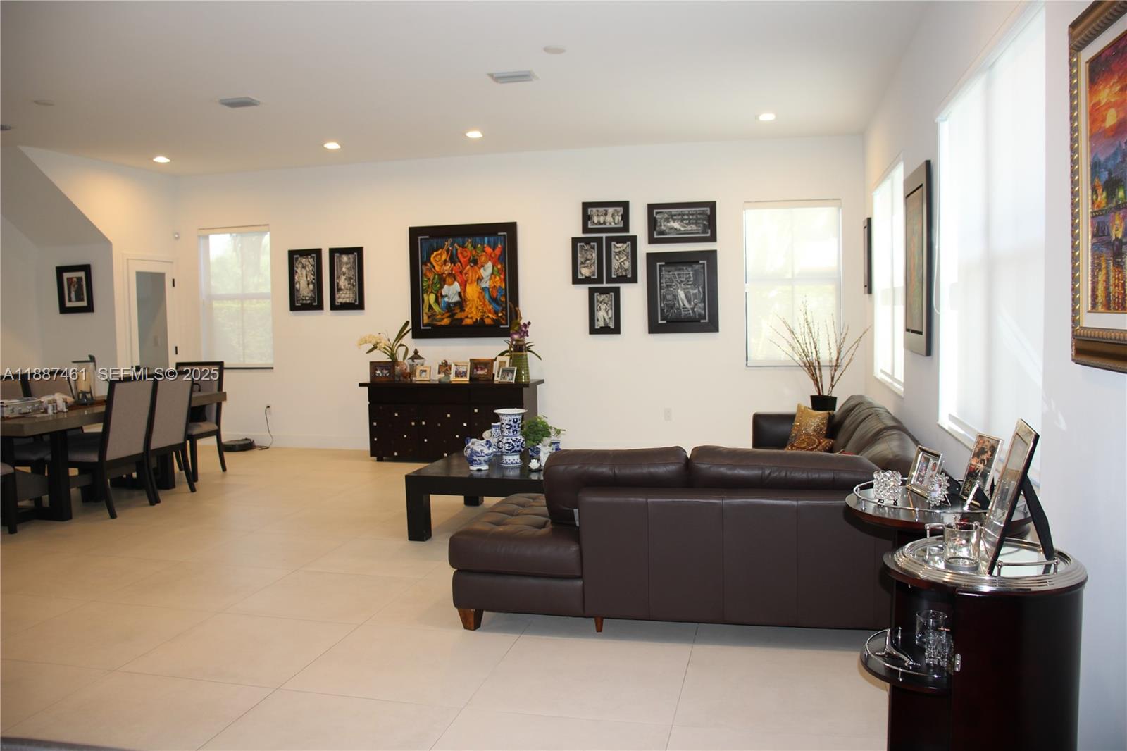 8904 Southwest 69th Trail Miami, FL 33173 - Photo 12 of 42 a living room with furniture and large windows