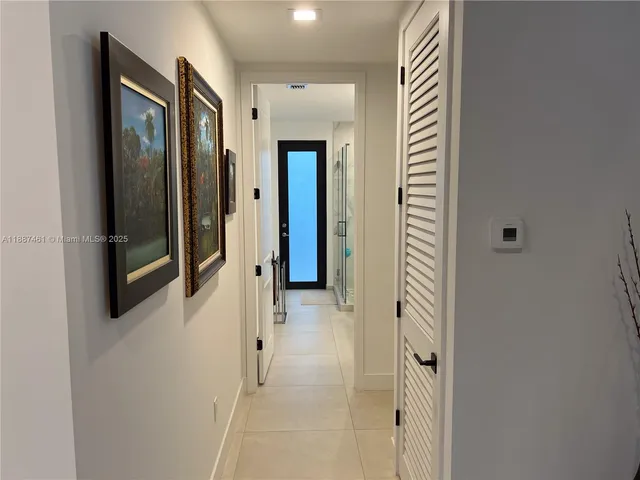 a bathroom with a shower a sink and a toilet