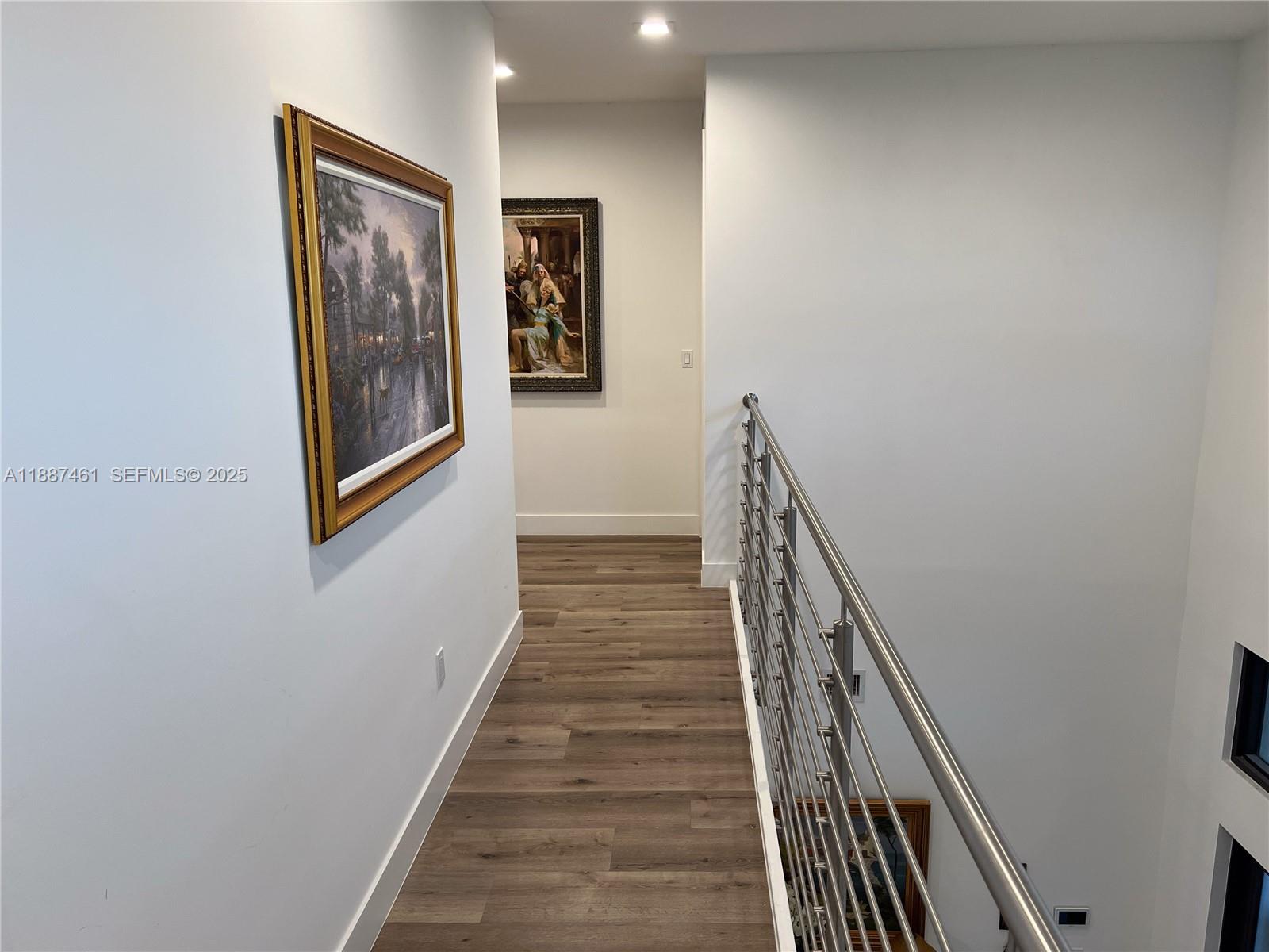 8904 Southwest 69th Trail Miami, FL 33173 - Photo 23 of 42 a view of a hallway with wooden floor and entryway