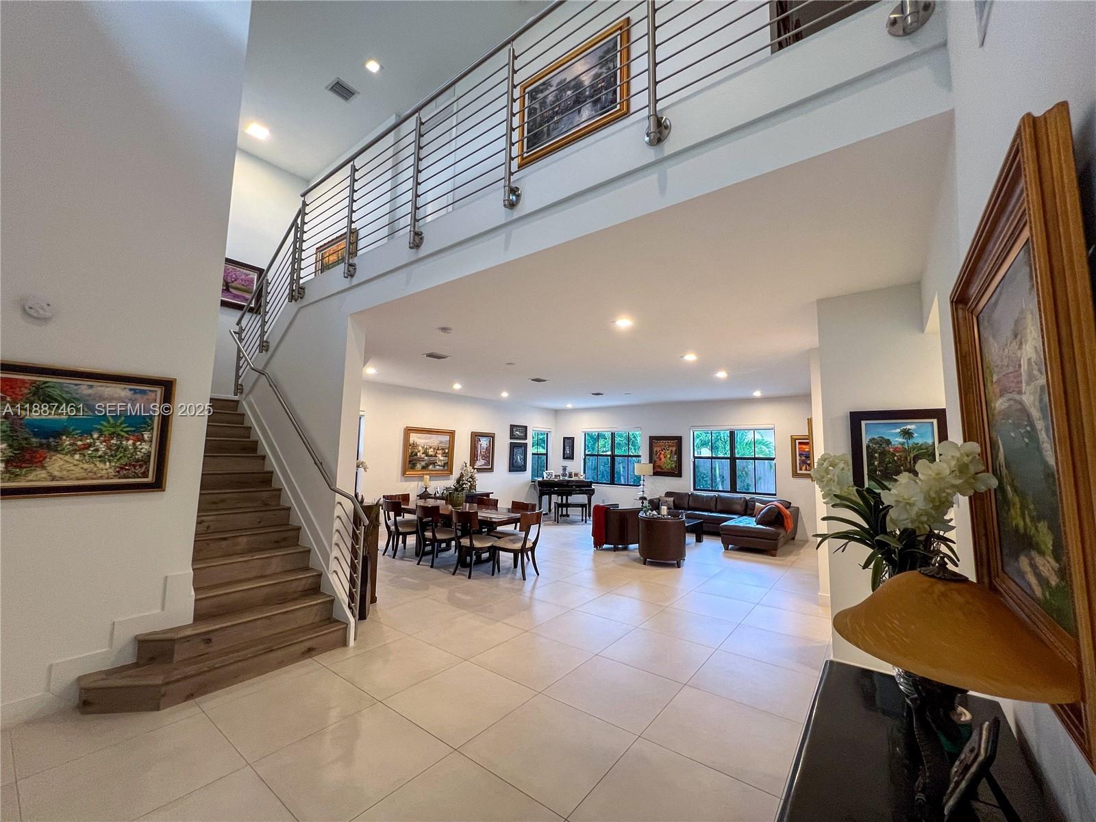 8904 Southwest 69th Trail Miami, FL 33173 - Photo 25 of 42 a lobby with furniture and a livingroom