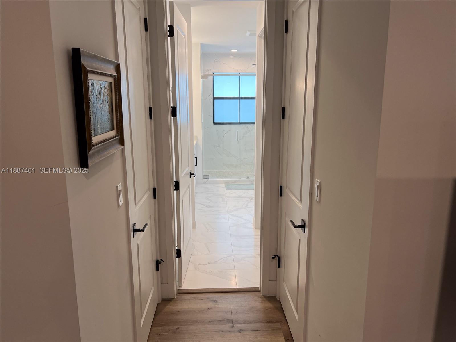 8904 Southwest 69th Trail Miami, FL 33173 - Photo 28 of 42 a view of a bathroom from a hallway