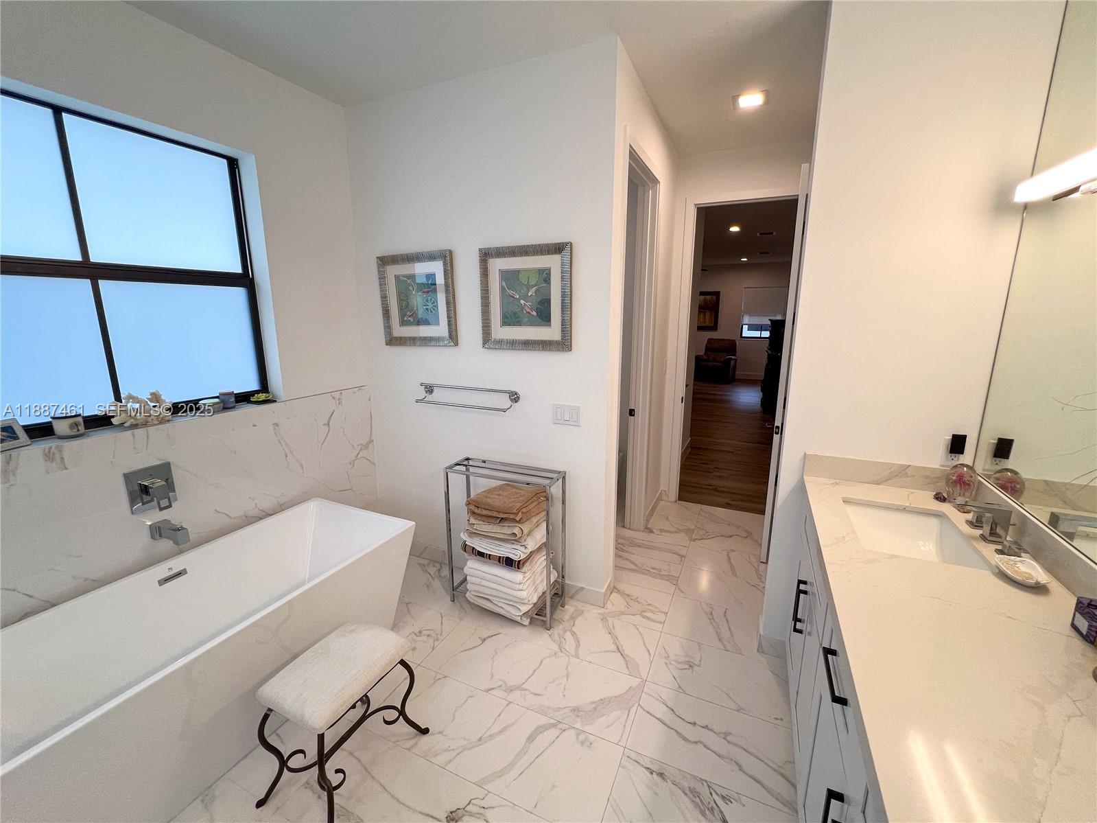 8904 Southwest 69th Trail Miami, FL 33173 - Photo 30 of 42 a bathroom with a sink a toilet and mirror