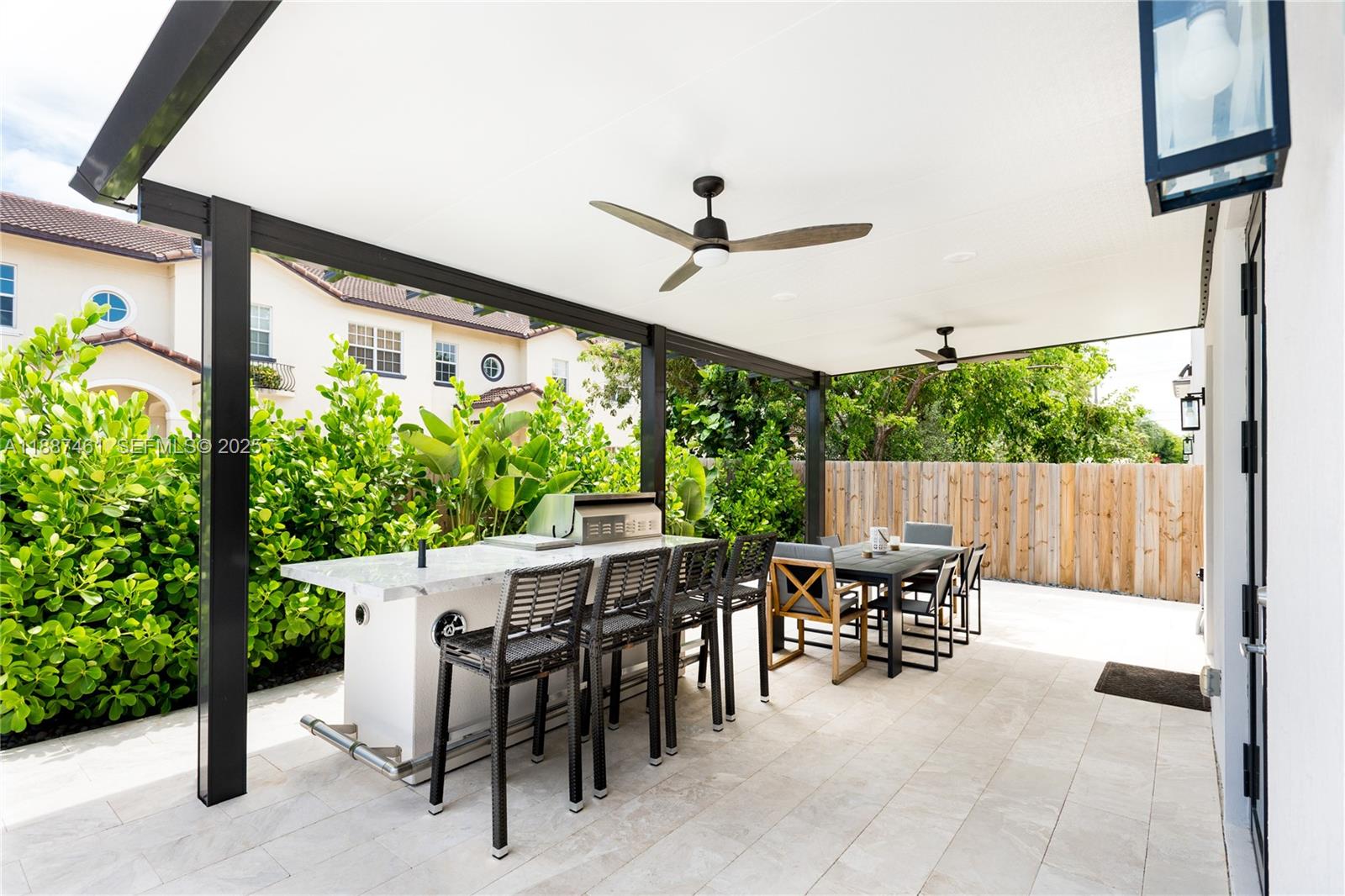 8904 Southwest 69th Trail Miami, FL 33173 - Photo 34 of 42 a view of an outside dining space with furniture