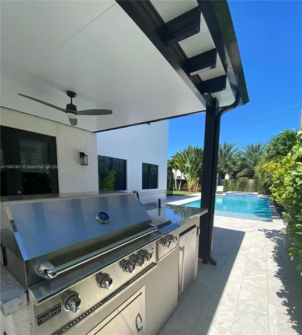 a view of a patio with a table and chairs