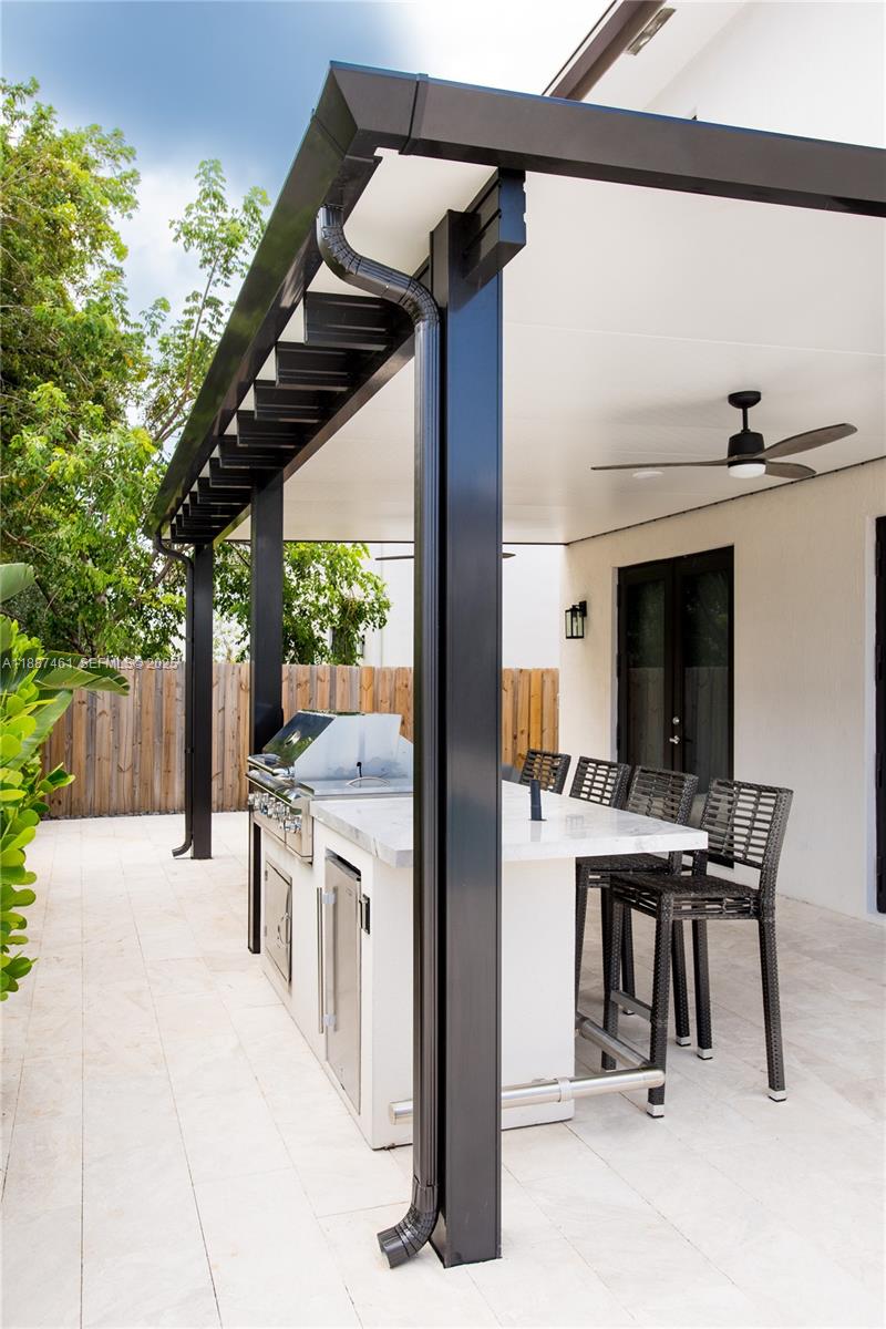 8904 Southwest 69th Trail Miami, FL 33173 - Photo 39 of 42 a view of a patio with a table and chairs