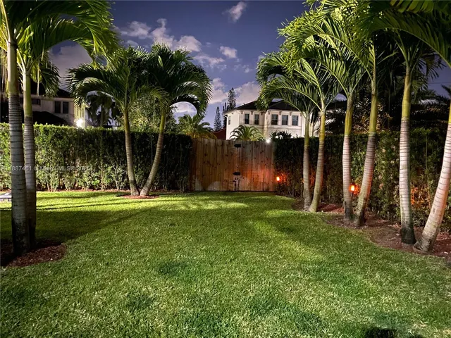 a view of backyard with trampoline
