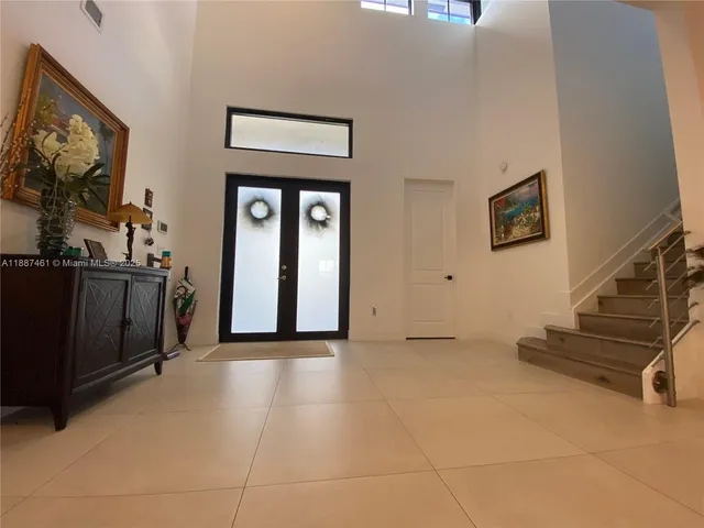 a view of a livingroom with furniture and a flat screen tv