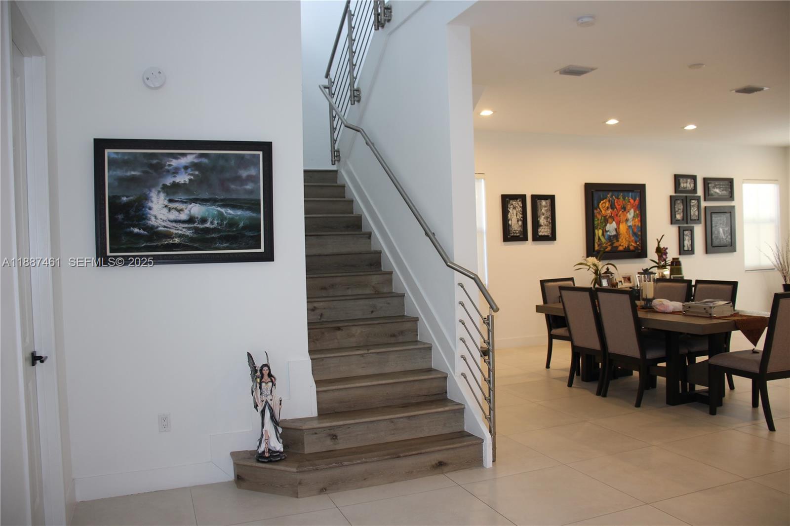 8904 Southwest 69th Trail Miami, FL 33173 - Photo 10 of 42 a view of a dining room with furniture