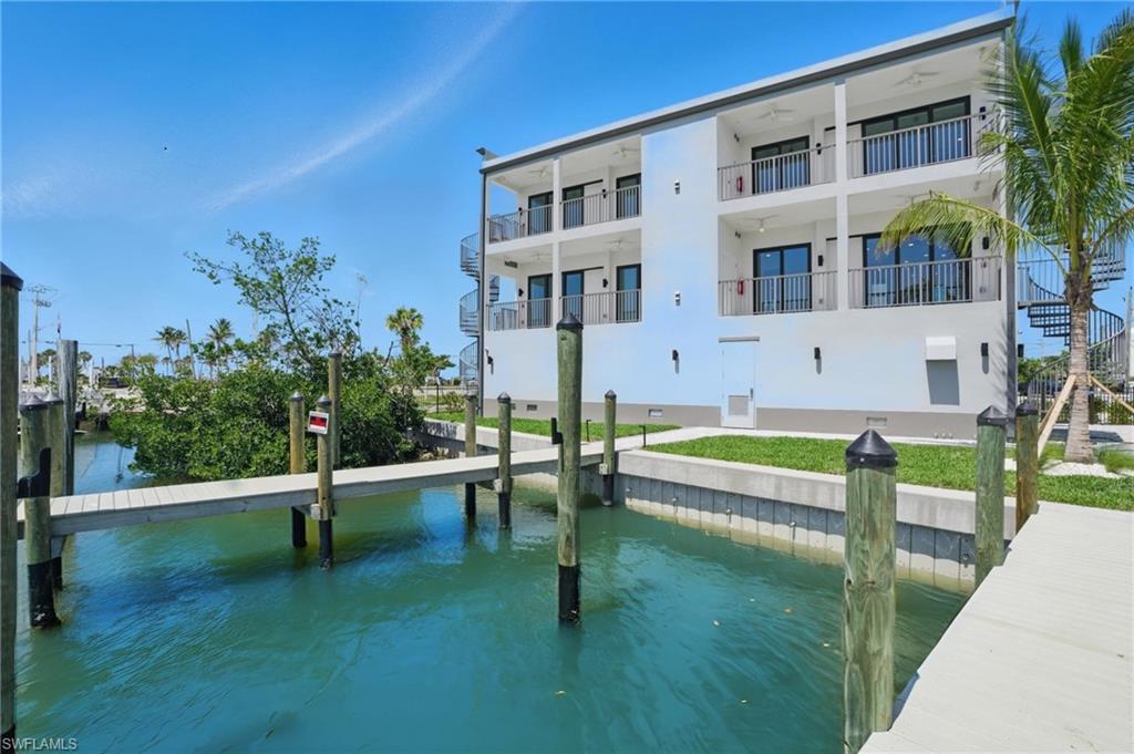 855 Lagoon Street, Unit 4 Fort Myers Beach, FL 33931 - Photo 12 of 40 a view of a house with a yard