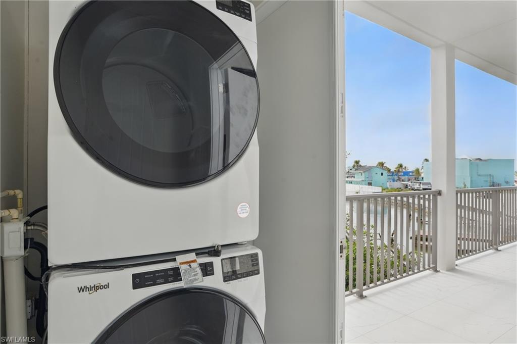 855 Lagoon Street, Unit 4 Fort Myers Beach, FL 33931 - Photo 16 of 40 a view of a hallway with washer and dryer