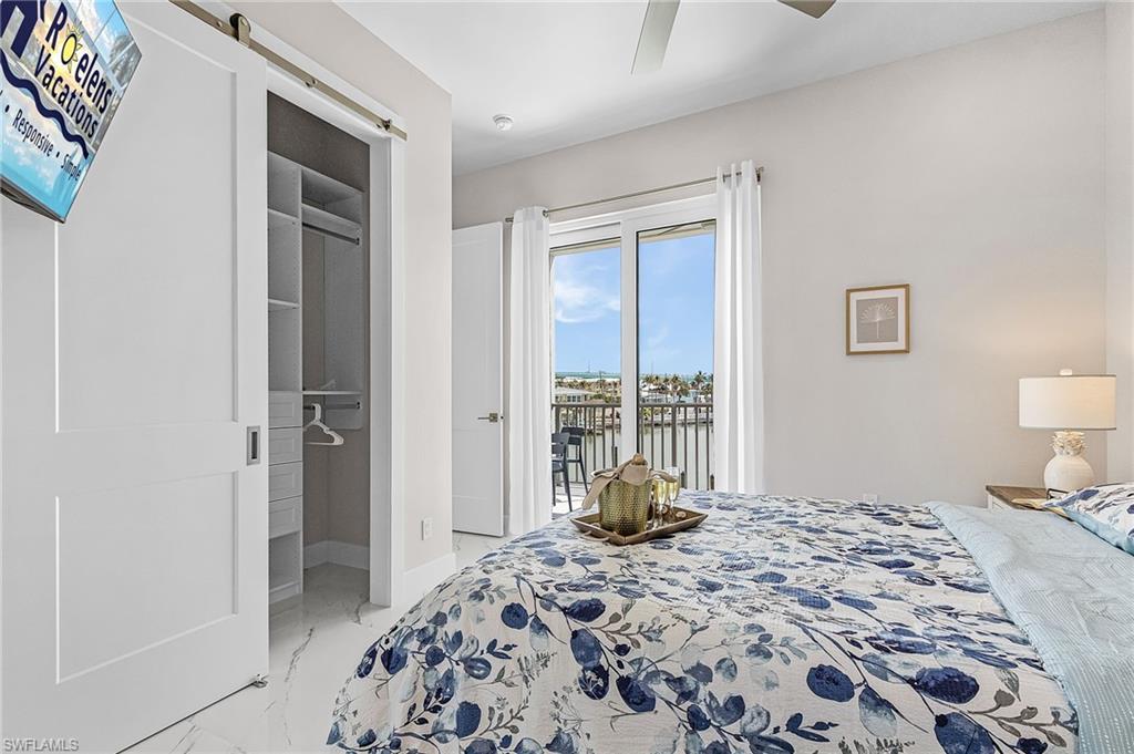 855 Lagoon Street, Unit 4 Fort Myers Beach, FL 33931 - Photo 21 of 40 a bedroom with a bed and a dresser