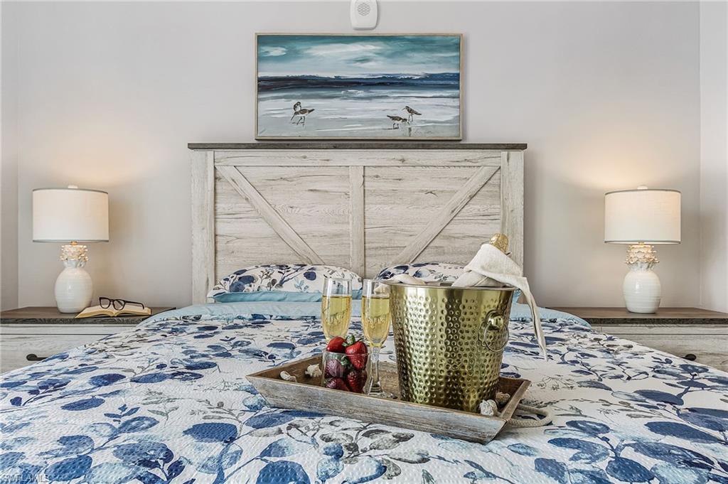 855 Lagoon Street, Unit 4 Fort Myers Beach, FL 33931 - Photo 23 of 40 a bedroom with a bed and a window
