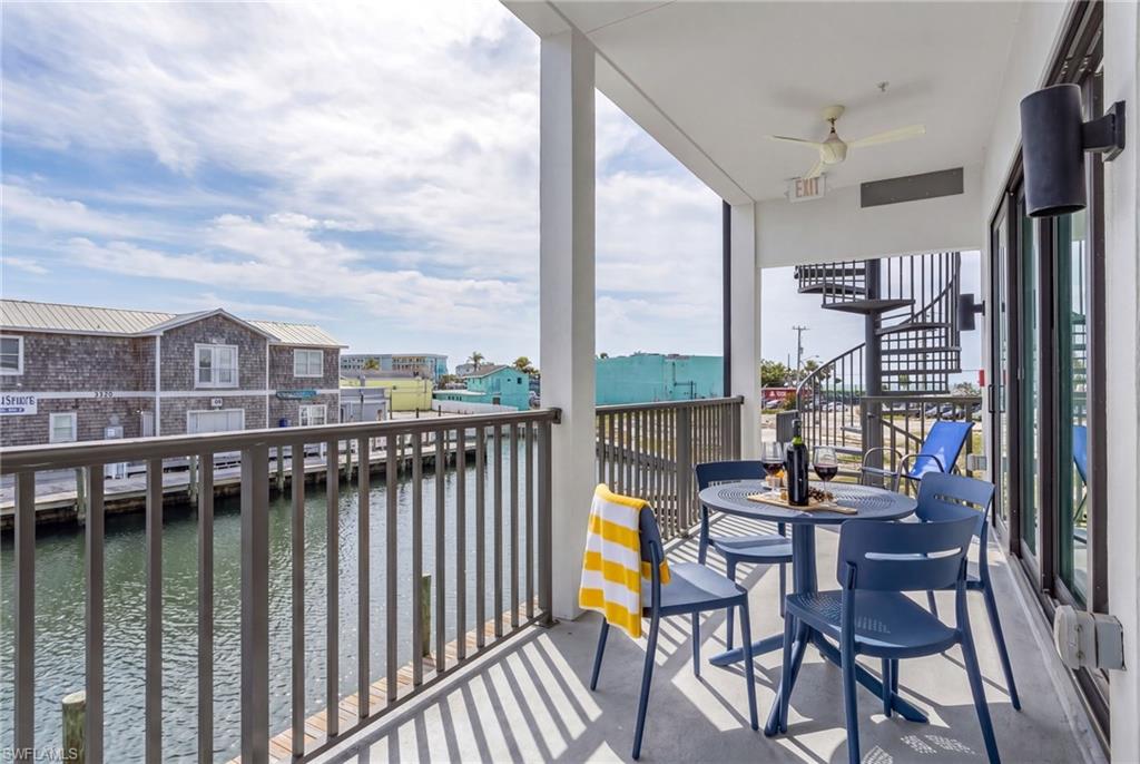 855 Lagoon Street, Unit 4 Fort Myers Beach, FL 33931 - Photo 37 of 40 a view of a balcony with chairs
