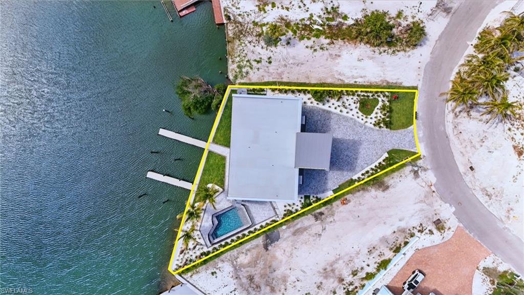 855 Lagoon Street, Unit 4 Fort Myers Beach, FL 33931 - Photo 5 of 40 an aerial view of a tennis court