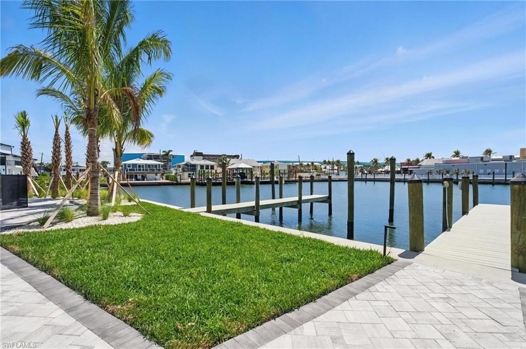 855 Lagoon Street, Unit 4 Fort Myers Beach, FL 33931 - Photo 10 of 40 a view of a garden and lake