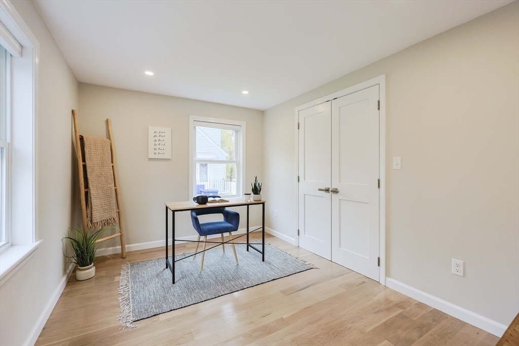 81 Elliott Street Danvers, MA 01923 - Photo 16 of 31 a view of a workspace with furniture and a window