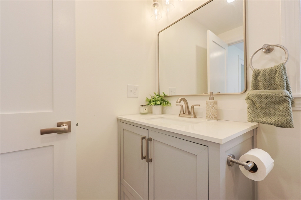 81 Elliott Street Danvers, MA 01923 - Photo 21 of 31 a bathroom with a sink vanity and mirror