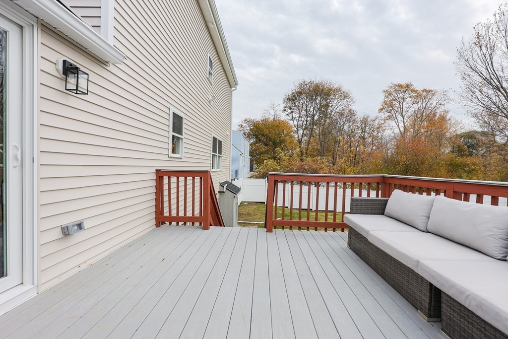81 Elliott Street Danvers, MA 01923 - Photo 27 of 31 a balcony with a furniture