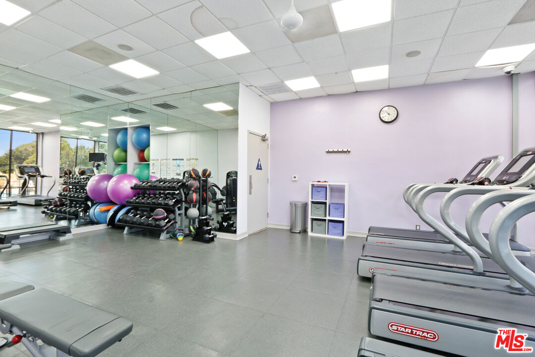 2160 Century Park, Unit 605 Los Angeles, CA 90067 - Photo 17 of 18 a view of a room with gym equipment