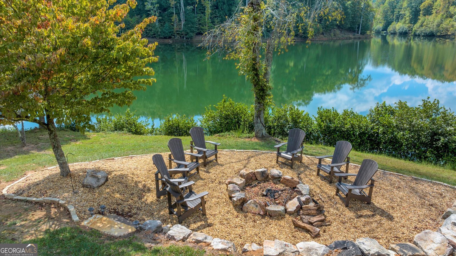 Lot 54 Mountainside Drive Cleveland, GA 30528 - Photo 11 of 14 a view of a lake with a table and chairs