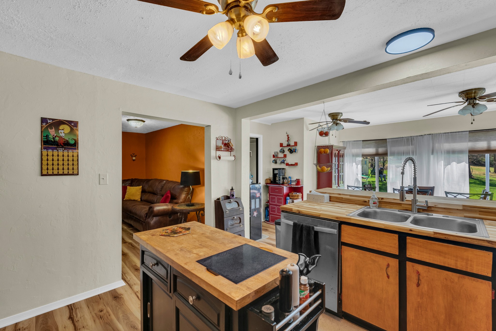 105 Dripping Springs Road Monterey, TN 38574 - Photo 11 of 49 a room with furniture a chandelier and a flat screen tv