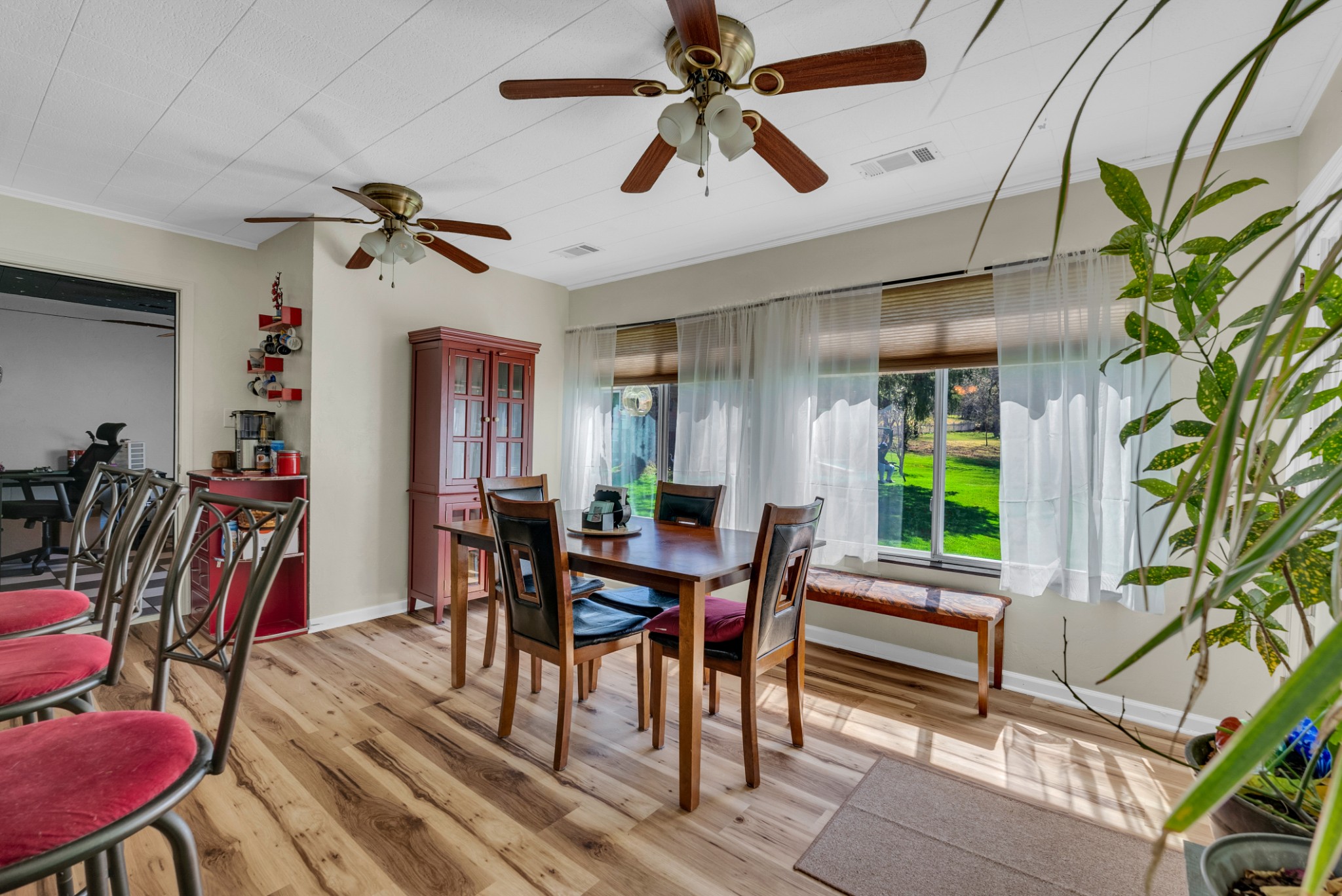 105 Dripping Springs Road Monterey, TN 38574 - Photo 12 of 49 a view of a dining room with furniture and a potted plant