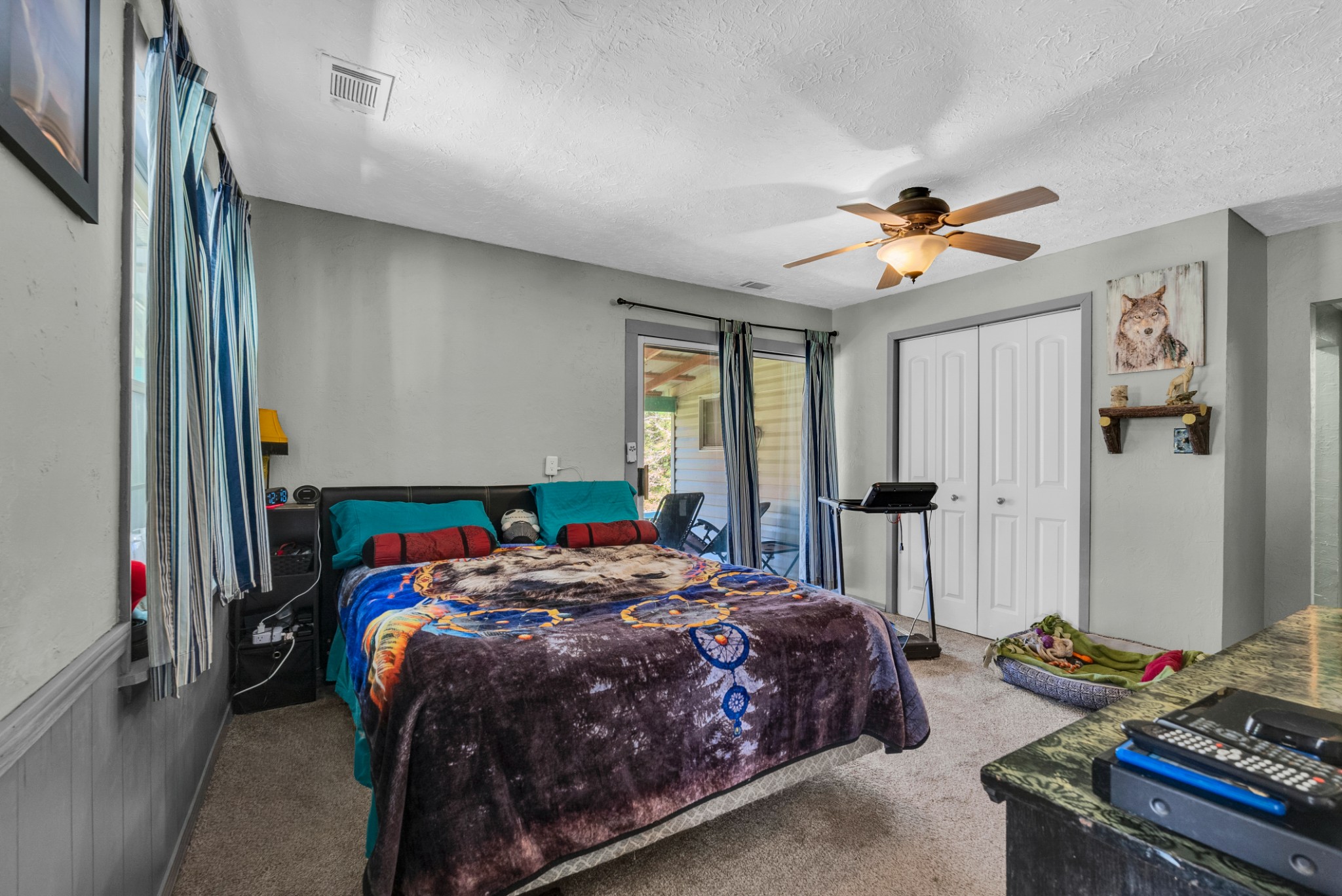 105 Dripping Springs Road Monterey, TN 38574 - Photo 15 of 49 a bedroom with a bed and a chandelier