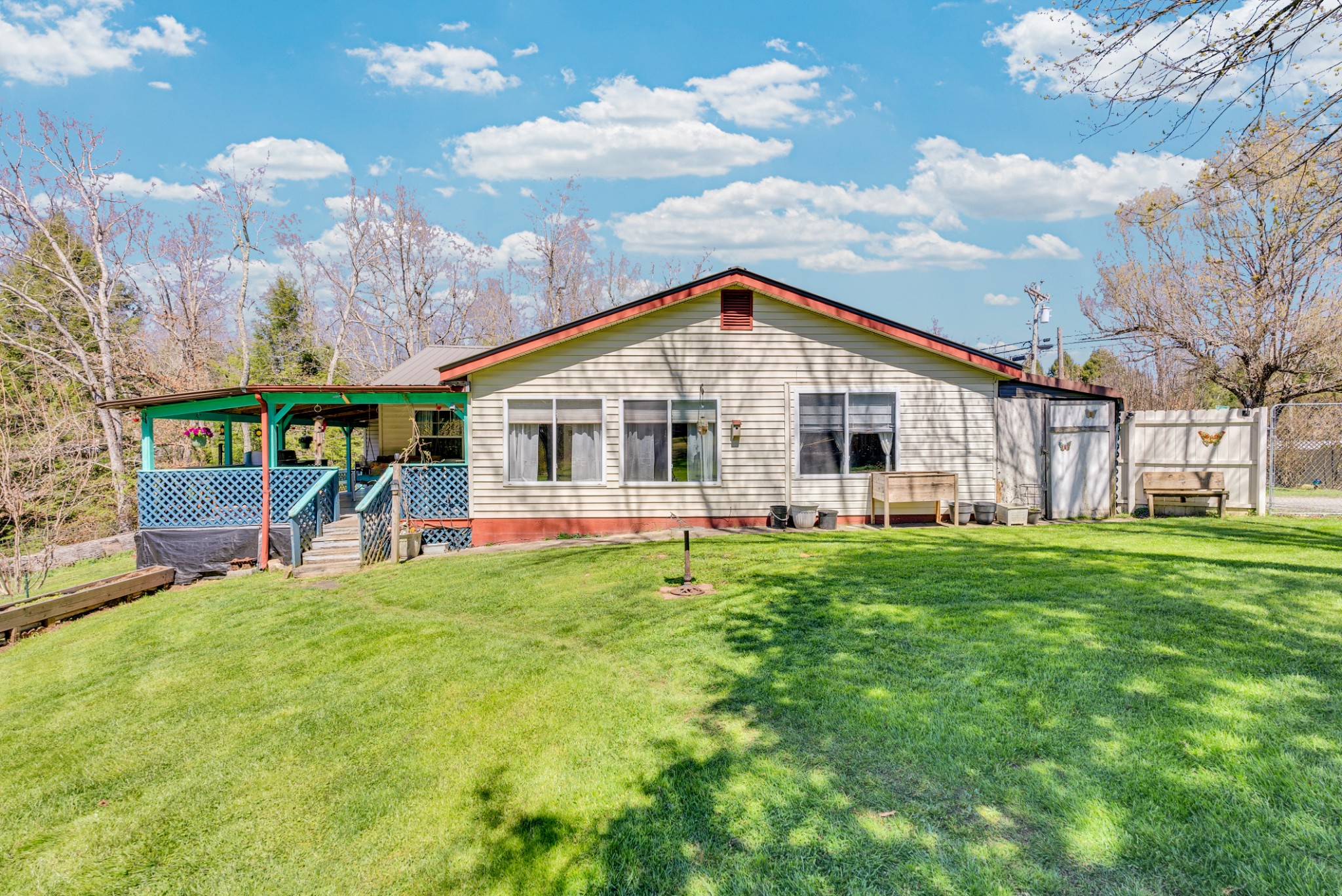 105 Dripping Springs Road Monterey, TN 38574 - Photo 27 of 49 a view of a house with a yard and sitting area