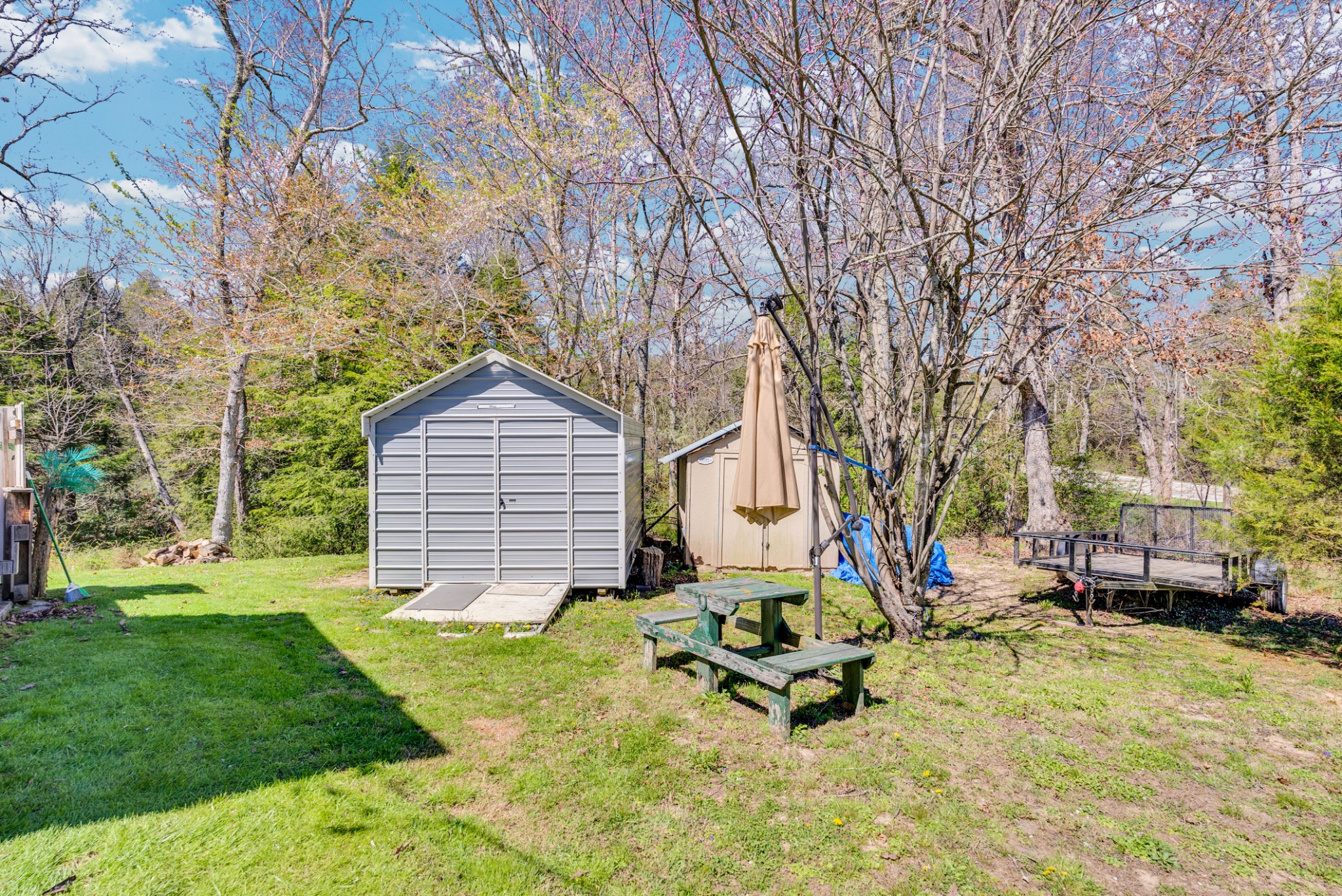 105 Dripping Springs Road Monterey, TN 38574 - Photo 30 of 49 a backyard of a house with yard and outdoor seating