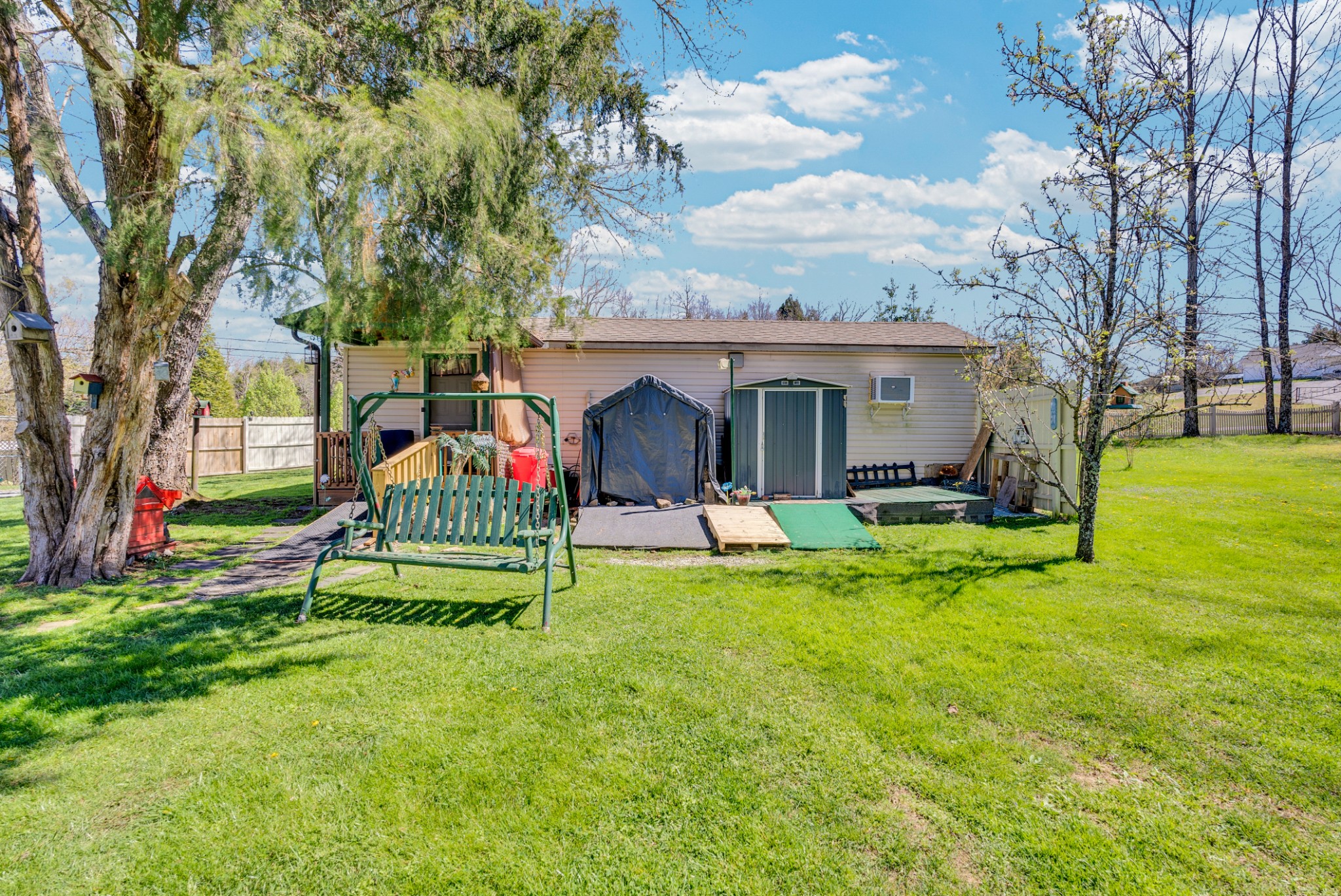 105 Dripping Springs Road Monterey, TN 38574 - Photo 35 of 49 a view of backyard with table and chairs and floor to ceiling window
