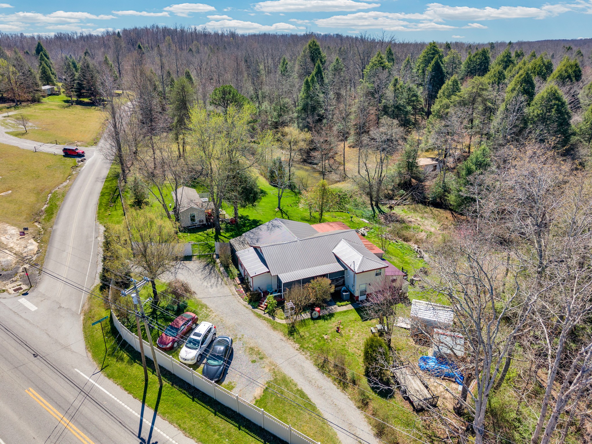 105 Dripping Springs Road Monterey, TN 38574 - Photo 46 of 49 an aerial view of a house with a garden and lake view