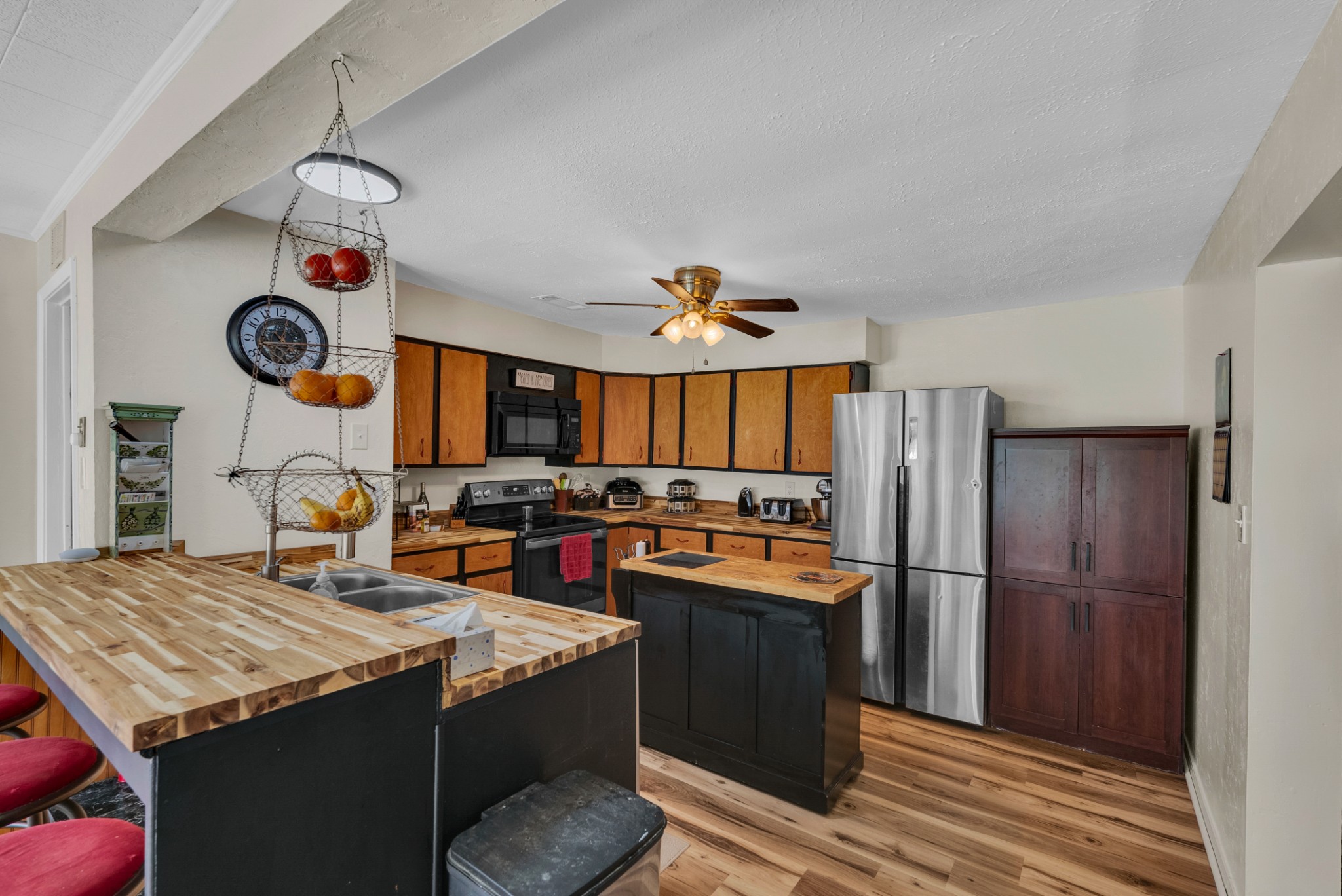 105 Dripping Springs Road Monterey, TN 38574 - Photo 9 of 49 a kitchen with kitchen island granite countertop a sink appliances and cabinets