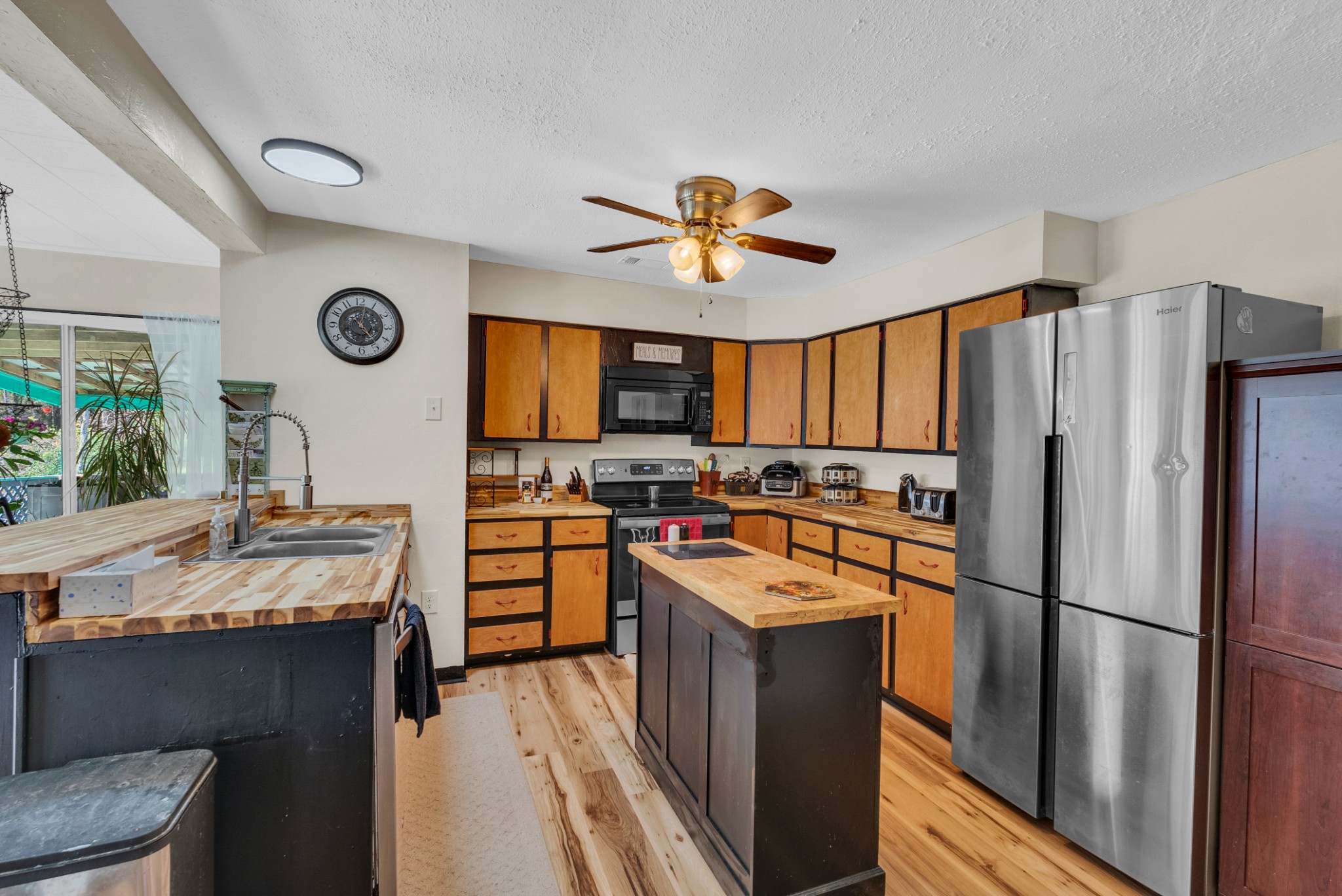 105 Dripping Springs Road Monterey, TN 38574 - Photo 10 of 49 a kitchen with stainless steel appliances a refrigerator a stove a sink and a refrigerator