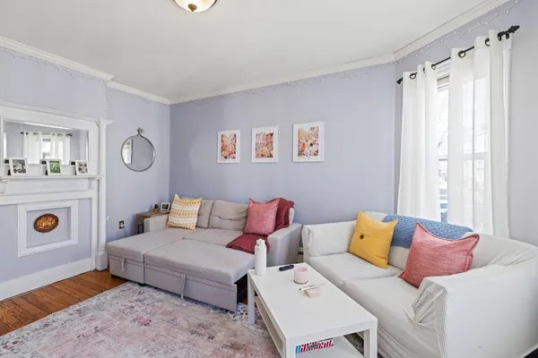 a living room with furniture and a table