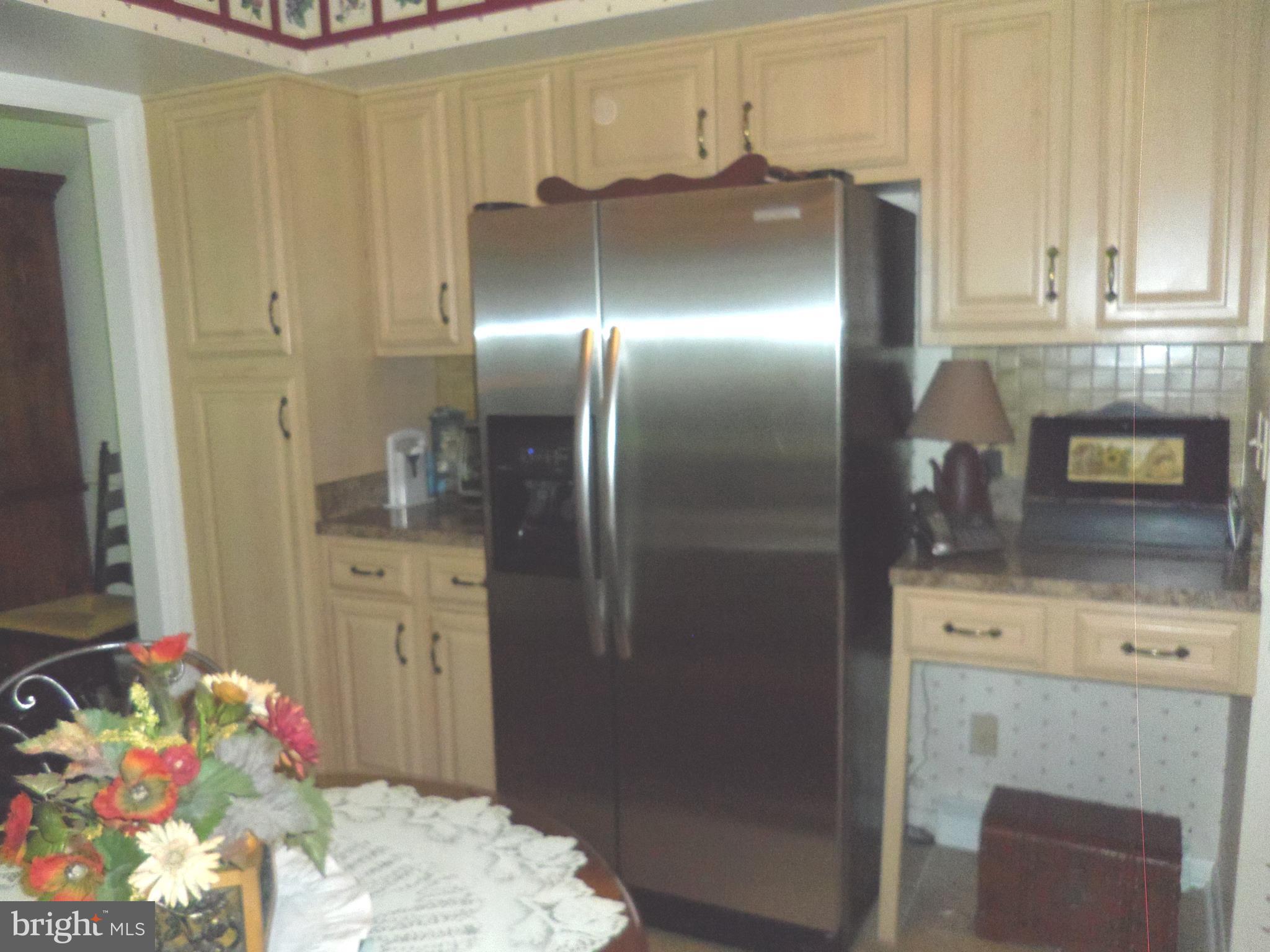 2 Manor Brook Road Monkton, MD 21111 - Photo 14 of 22 a kitchen with granite countertop a refrigerator and stove