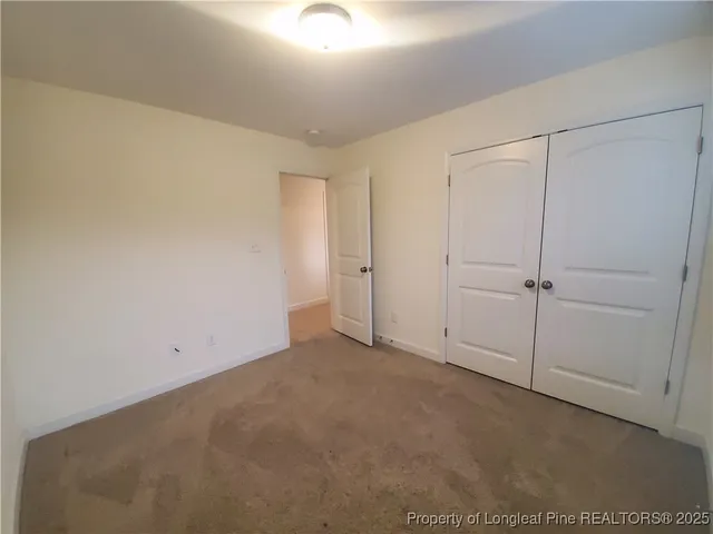 an empty room with white walls
