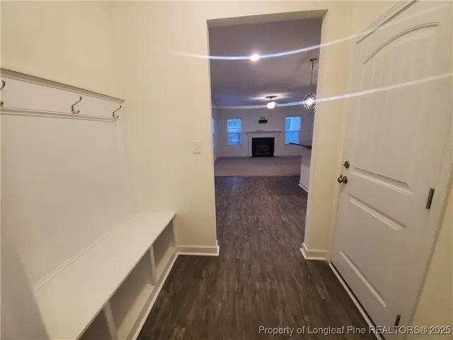 a view of hallway with wooden floor